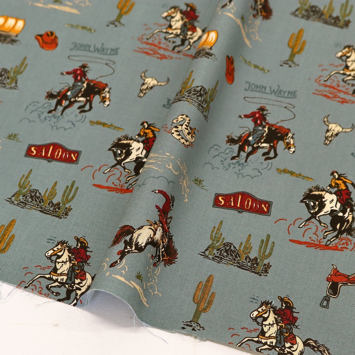 USA2607-724 Light blue Western Cowboy USA print USA cotton sheeting Width approx. 110cm 1m unit (m)USAプリント　USAコットン　シーチング